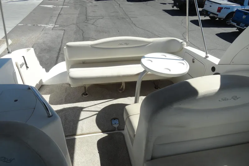 Slide: The Image of 2004 Sea Ray Sundancer 280 boat interior with seating and table. - 30