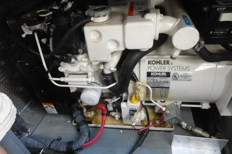 Slide: The Image of Engine compartment of a 2004 Sea Ray Sundancer 280 with Kohler power system. - 34