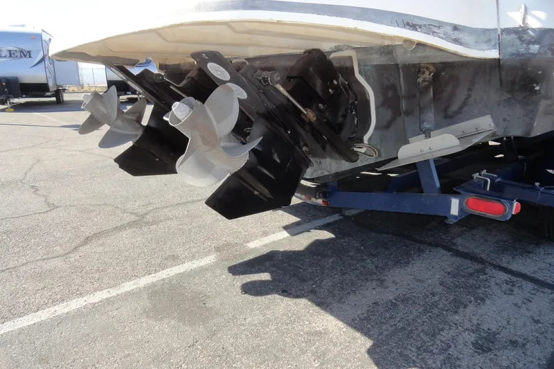 Slide: The Image of Rear view of a 2004 Sea Ray Sundancer 280 boat on a trailer, showing dual propellers. - 38