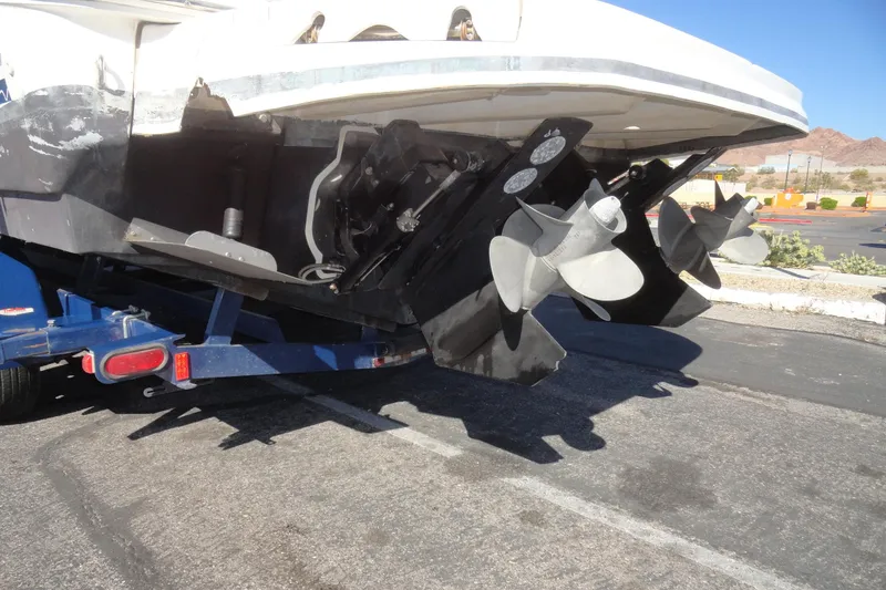 Slide: The Image of 2004 Sea Ray Sundancer 280 boat on trailer, showing dual propellers and stern drive. - 39