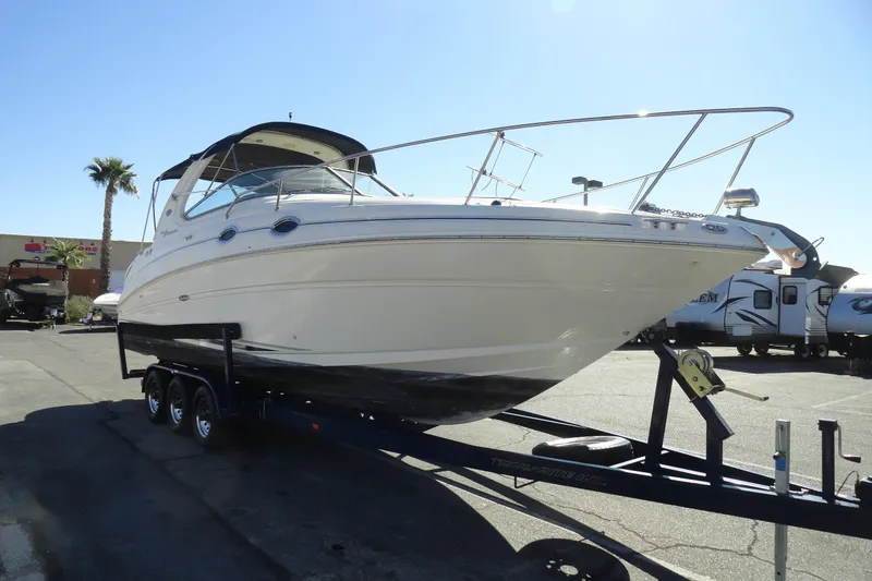 Slide: The Image of 2004 Sea Ray Sundancer 280 boat on trailer in sunny outdoor setting. - 4