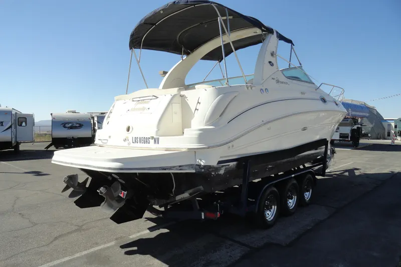 Slide: The Image of 2004 Sea Ray Sundancer 280 boat on trailer in parking lot. - 5