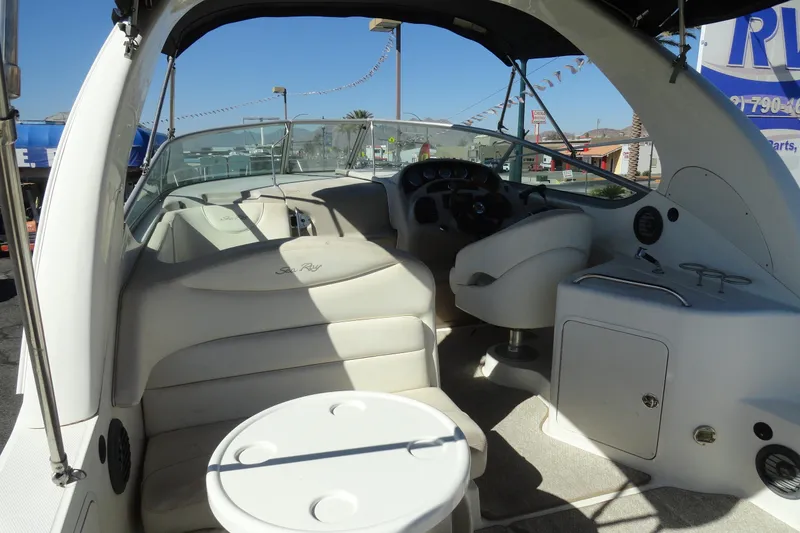 Slide: The Image of 2004 Sea Ray Sundancer 280 boat interior with seating and helm. - 7