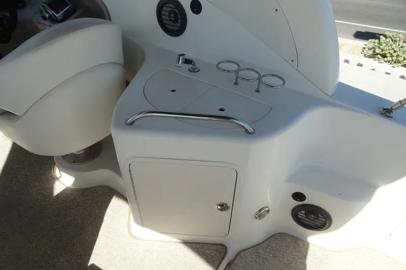 Slide: The Image of Interior view of a 2004 Sea Ray Sundancer 280 boat cockpit area. - 8