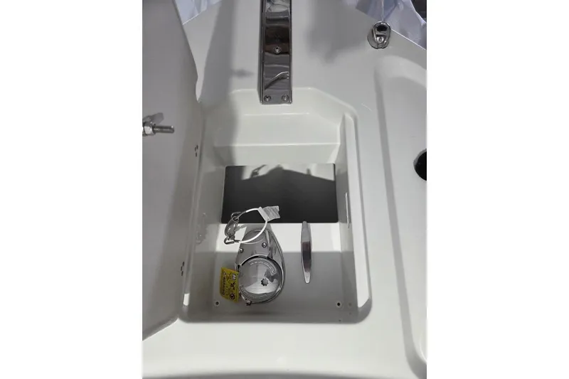 Slide: The Image of Parker 247 Explorer 2026 boat compartment with stainless steel fittings and storage space. - 10