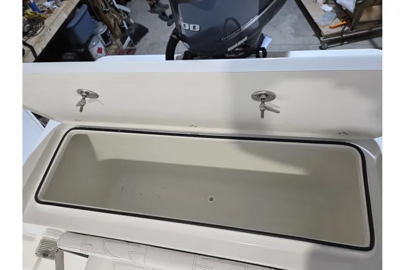 Slide: The Image of Open storage compartment on a 2026 Parker 247 Explorer boat, showcasing interior space. - 15