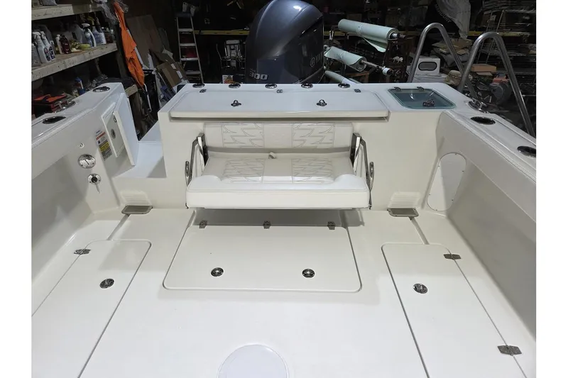 Slide: The Image of 2026 Parker 247 Explorer boat interior with seating and storage compartments. - 16
