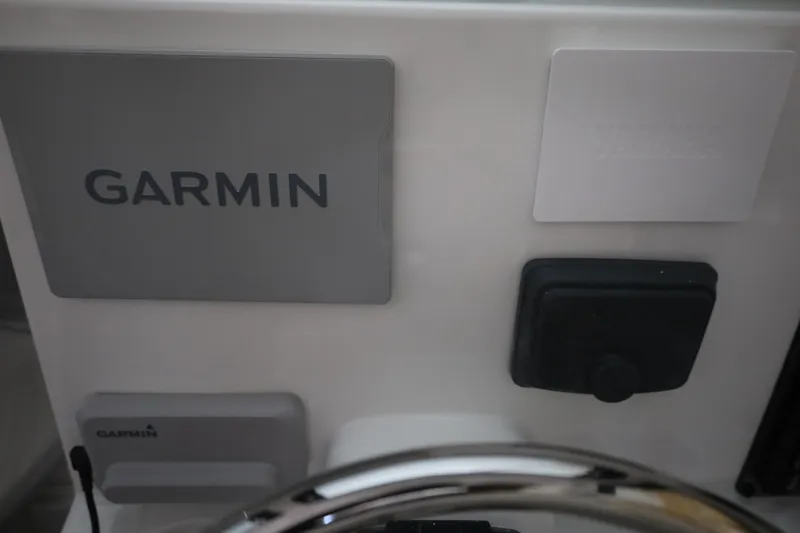 Slide: The Image of Control panel of 2026 Parker 247 Explorer featuring Garmin equipment. - 21