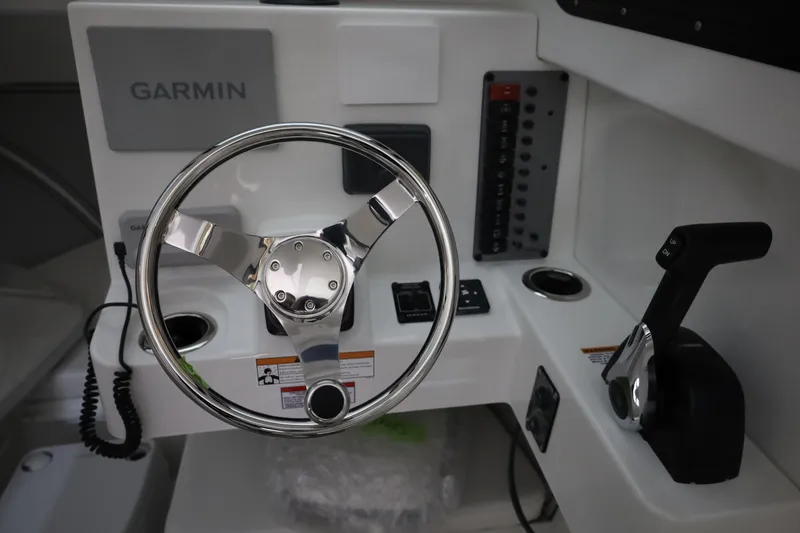 Slide: The Image of Steering console of 2026 Parker 247 Explorer boat with Garmin navigation system. - 22