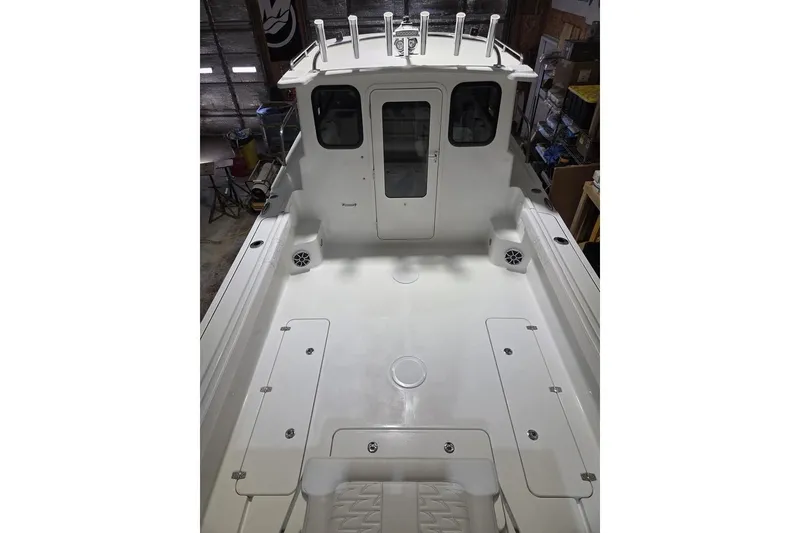 Slide: The Image of 2026 Parker 247 Explorer boat interior, featuring spacious deck and modern design. - 4
