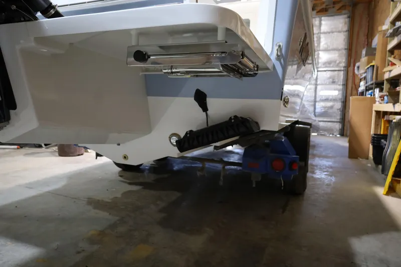 Slide: The Image of 2026 Parker 247 Explorer boat on trailer in garage setting. - 8