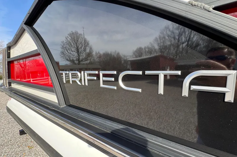 Slide: The Image of 2024 Trifecta 25ULE SS boat with reflective branding and sleek design. - 15