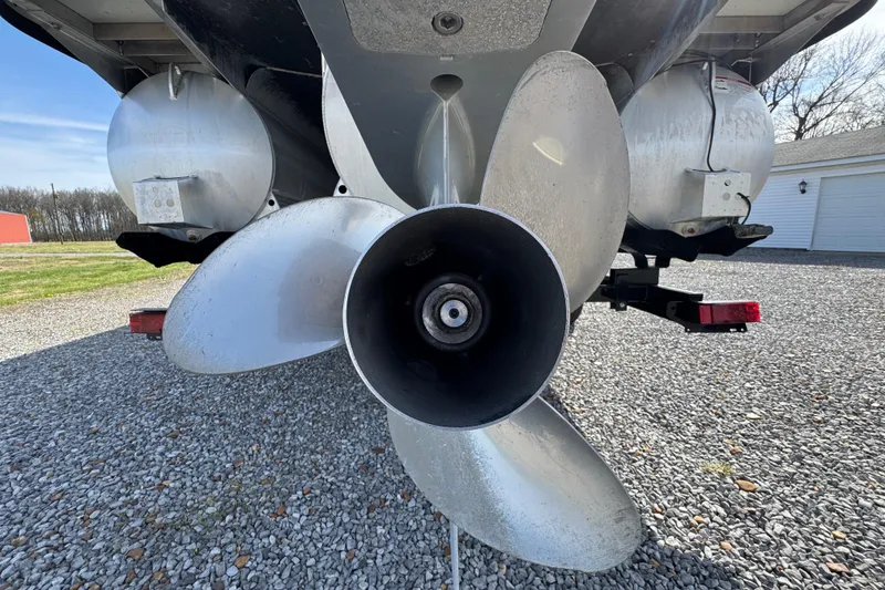 Slide: The Image of Close-up of 2024 Trifecta 25ULE SS boat propeller on gravel surface. - 17