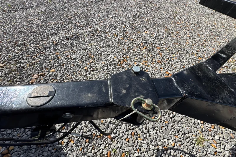 Slide: The Image of Trailer hitch of 2024 Trifecta 25ULE SS on gravel surface. - 19