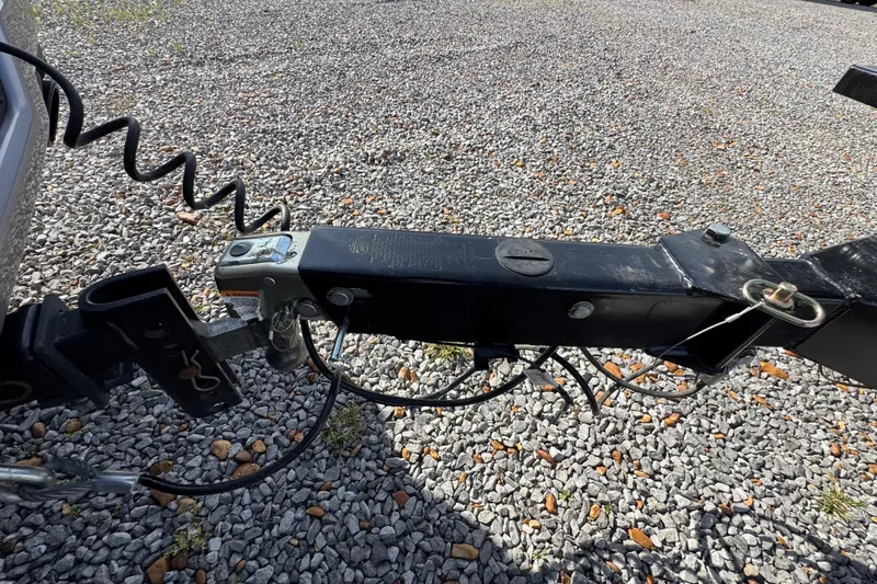 Slide: The Image of Trailer hitch of 2024 Trifecta 25ULE SS on gravel surface. - 20