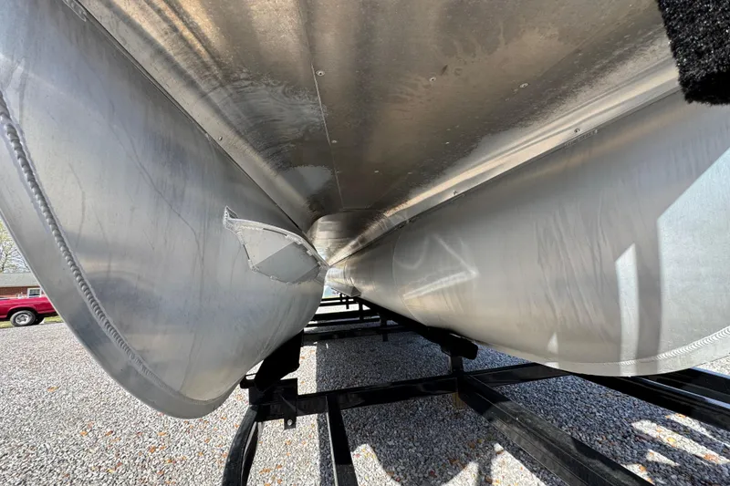 Slide: The Image of 2024 Trifecta 25ULE SS pontoon boat underside on trailer. - 28