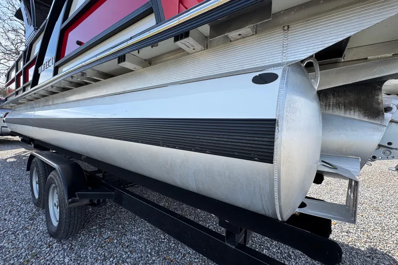 Slide: The Image of 2024 Trifecta 25ULE SS pontoon boat on trailer, side view. - 32