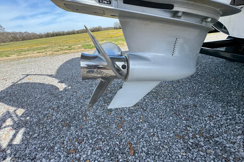 Slide: The Image of 2024 Trifecta 25ULE SS boat propeller on gravel surface. - 37