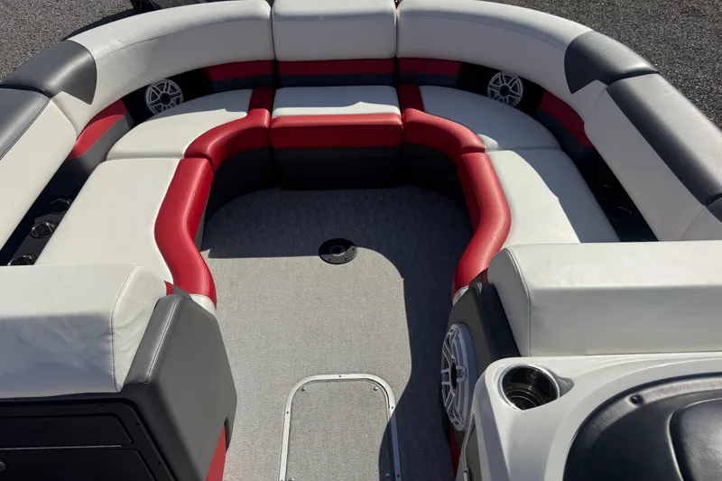Slide: The Image of 2024 Trifecta 25ULE SS boat interior with red and gray seating arrangement. - 46