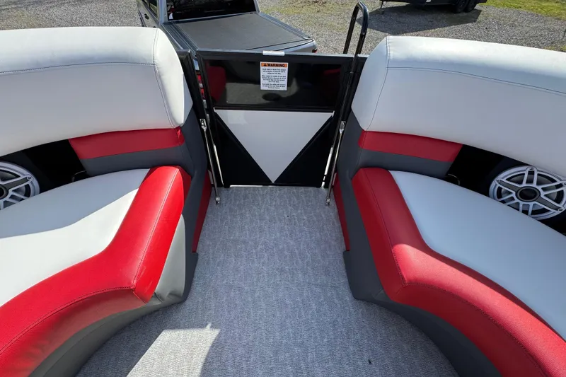 Slide: The Image of 2024 Trifecta 25ULE SS boat interior with red and gray seating, carpeted floor. - 47