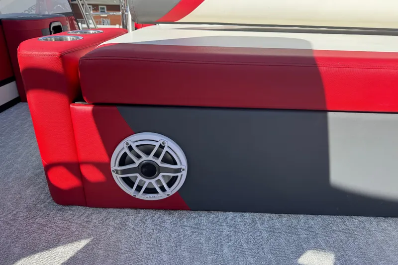 Slide: The Image of Red and gray seating with speaker on 2024 Trifecta 25ULE SS boat. - 55
