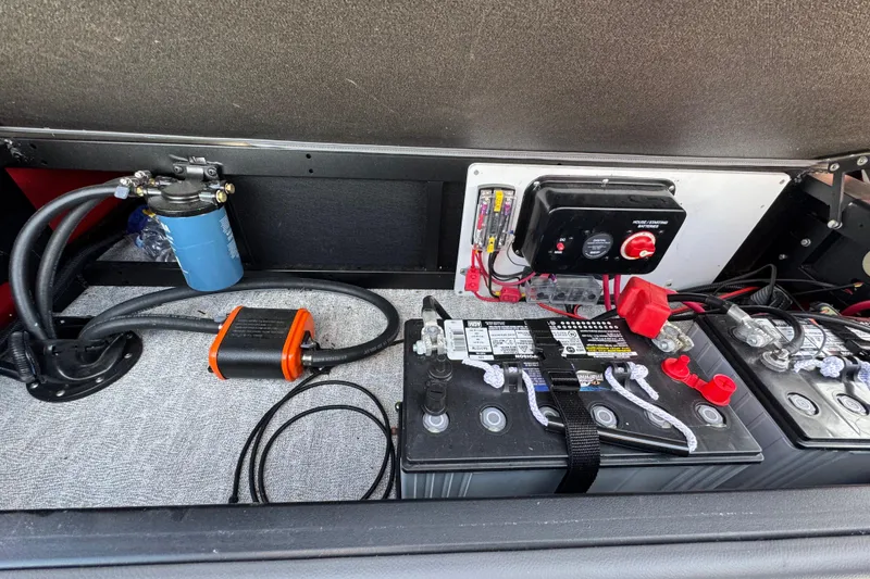 Slide: The Image of 2024 Trifecta 25ULE SS battery compartment with wiring and components. - 63