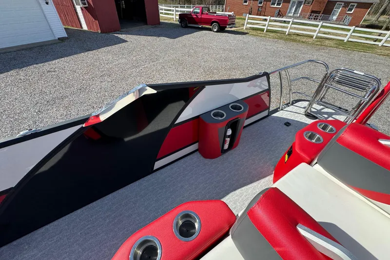 Slide: The Image of 2024 Trifecta 25ULE SS boat interior with red seating and cup holders. - 69
