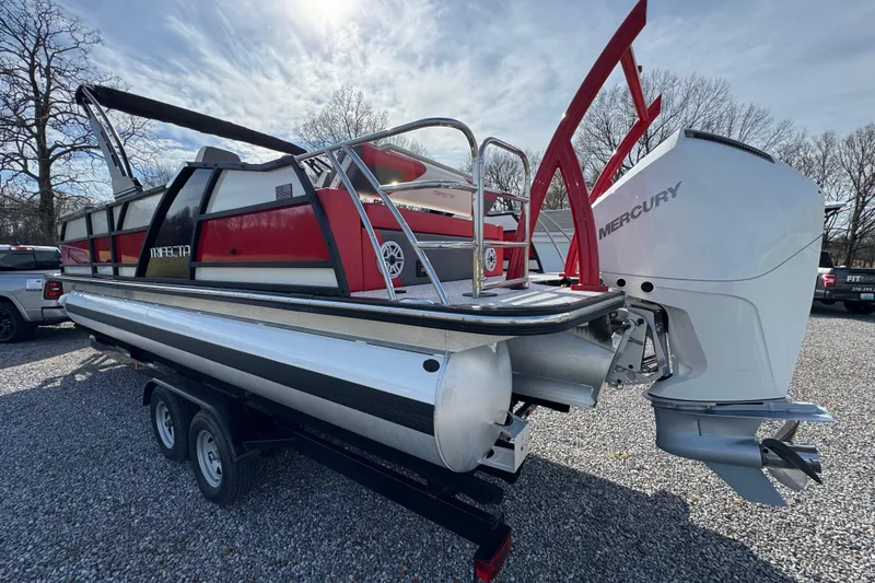Slide: The Image of 2024 Trifecta 25ULE SS pontoon boat with Mercury engine on trailer. - 7