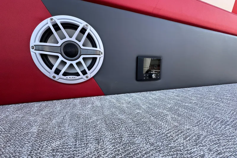 Slide: The Image of 2024 Trifecta 25ULE SS boat interior with JL Audio speaker and control panel. - 72