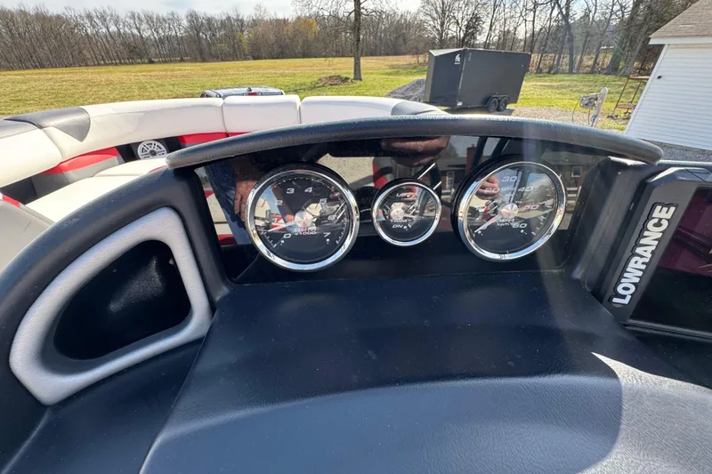 Slide: The Image of Dashboard of 2024 Trifecta 25ULE SS boat with gauges and Lowrance display. - 81