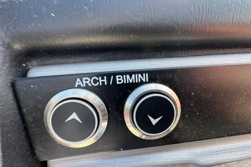 Slide: The Image of 2024 Trifecta 25ULE SS boat control panel with arch/bimini buttons. - 83