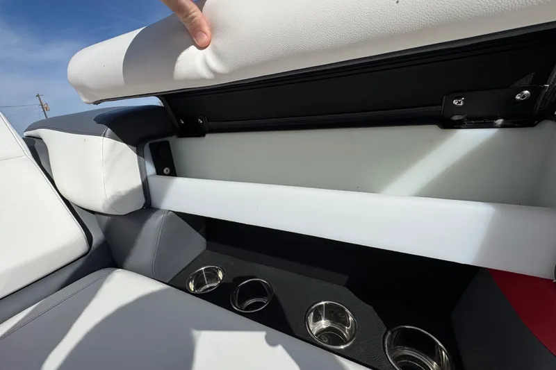 Slide: The Image of 2024 Trifecta 25ULE SS boat seat storage with cup holders, showcasing sleek design. - 88