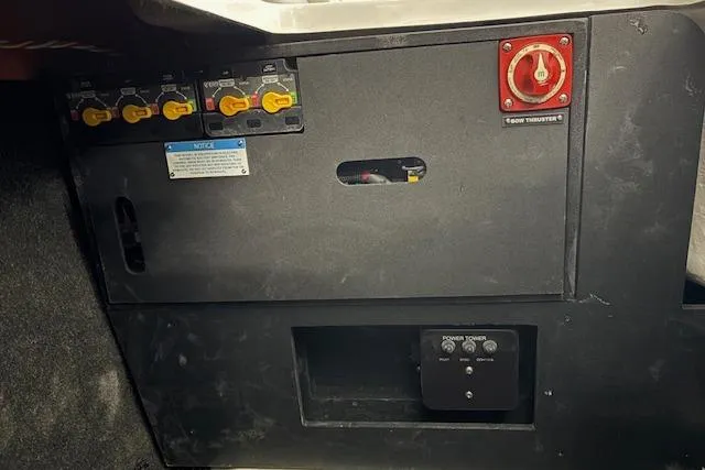 Slide: The Image of Control panel of a 2026 Regal LX6 boat with switches and power toggle. - 11