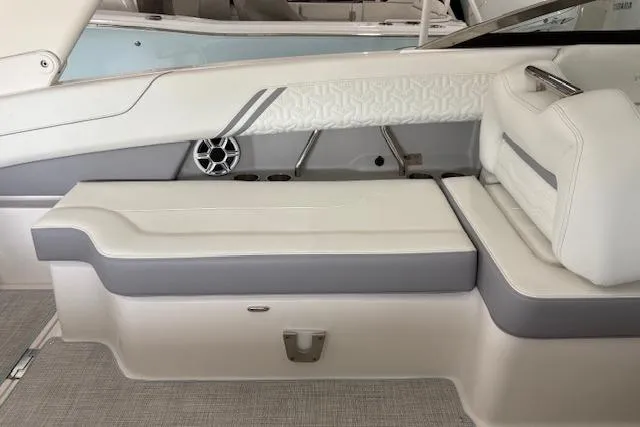 Slide: The Image of 2026 Regal LX6 boat interior with white and gray seating, modern design. - 12