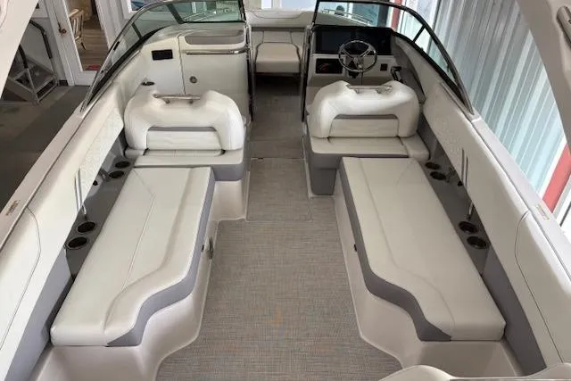 Slide: The Image of 2026 Regal LX6 boat interior with white seating and modern dashboard. - 4