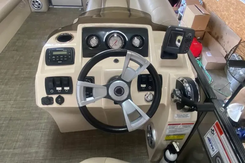 Slide: The Image of Steering console of a 2015 Crest 230 boat with gauges and controls. - 8