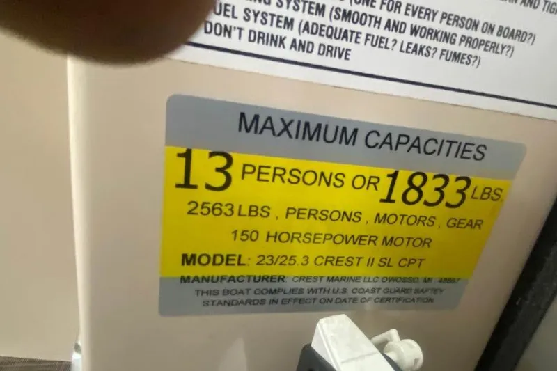 Slide: The Image of 2015 Crest 230 boat capacity label: 13 persons or 1833 lbs, 150 horsepower motor. - 9