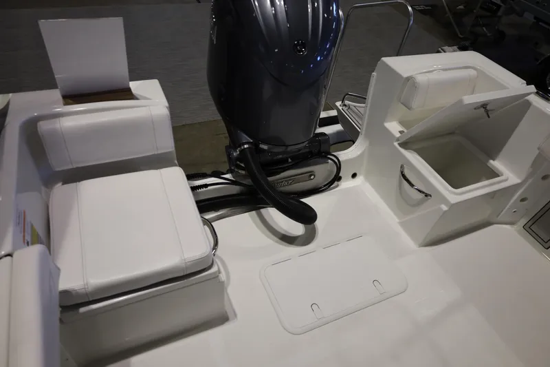 Slide: The Image of 2026 Parker 210 Coastal boat interior with seating and storage compartments. - 12