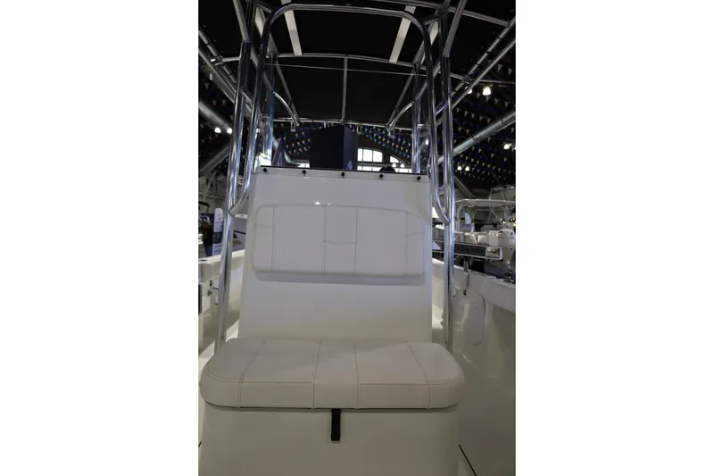 Slide: The Image of 2026 Parker 210 Coastal boat interior with white seating and metal framework. - 14