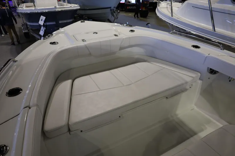 Slide: The Image of 2026 Parker 210 Coastal boat interior with cushioned seating and sleek design. - 16