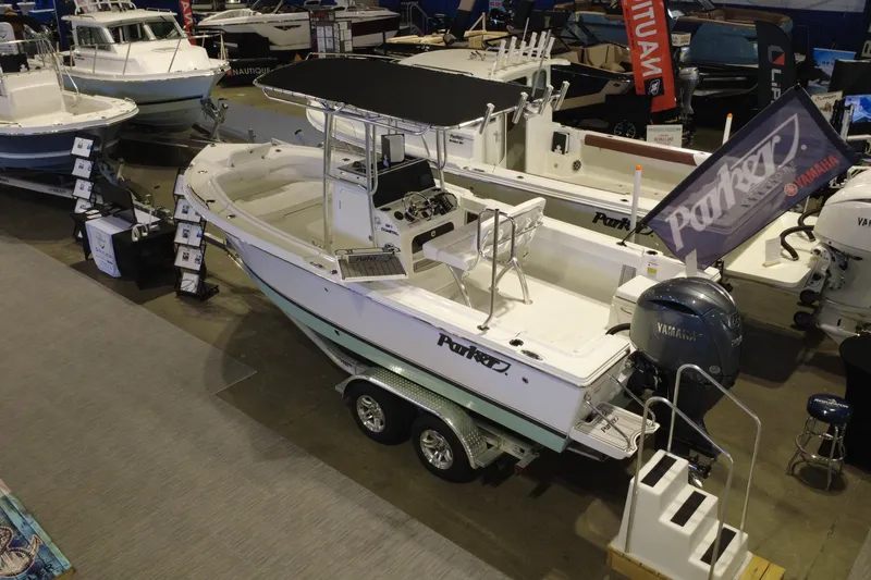 Slide: The Image of 2026 Parker 210 Coastal boat displayed at a marine exhibition with Yamaha engine. - 5