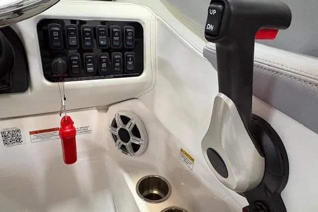 Slide: The Image of Control panel of 2026 Regal LX2 boat with switches and throttle lever. - 5