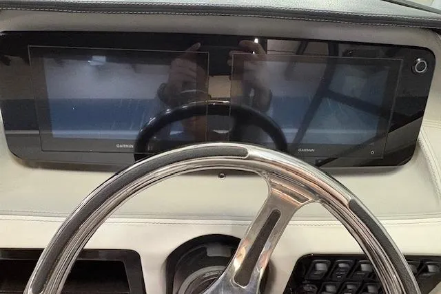 Slide: The Image of 2026 Regal LX2 dashboard with dual Garmin displays and sleek steering wheel. - 6