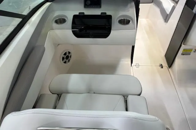 Slide: The Image of 2026 Regal LX2 boat interior with white seating and modern dashboard. - 7