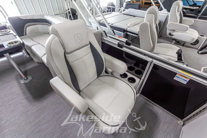 Slide: The Image of 2026 Godfrey Sweetwater 2286 SBC boat interior with luxurious seating and cup holders. - 12