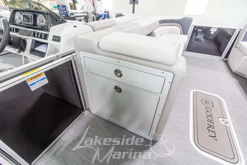 Slide: The Image of Interior of 2026 Godfrey Sweetwater 2286 SBC boat, featuring dashboard and seating. - 13