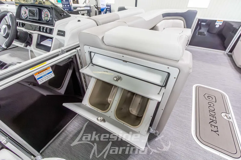Slide: The Image of Interior of 2026 Godfrey Sweetwater 2286 SBC pontoon boat with storage compartment open. - 14