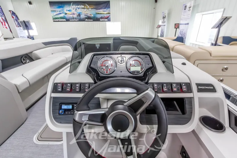 Slide: The Image of Interior view of 2026 Godfrey Sweetwater 2286 SBC boat dashboard at Lakeside Marina. - 16
