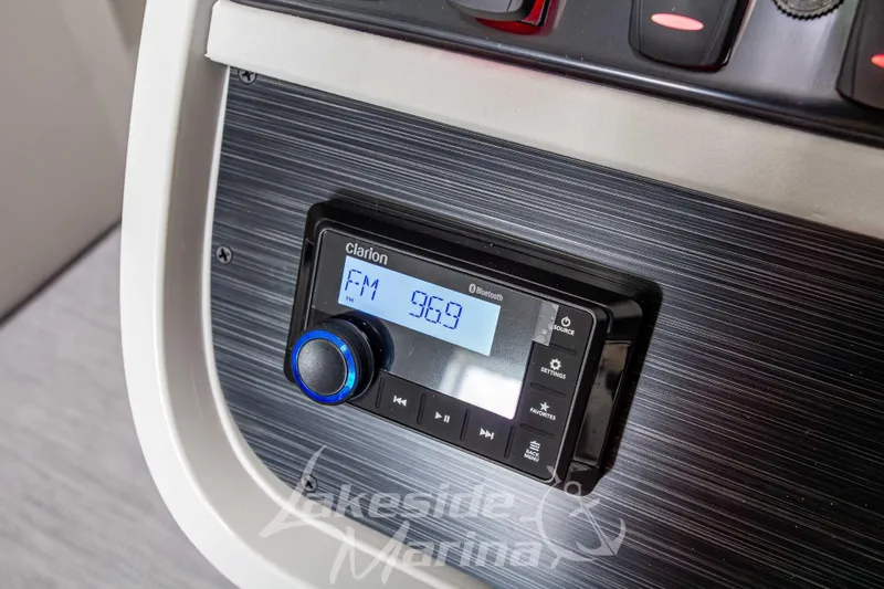 Slide: The Image of Clarion radio display on 2026 Godfrey Sweetwater 2286 SBC boat dashboard. - 18