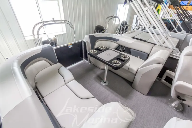 Slide: The Image of Interior of 2026 Godfrey Sweetwater 2286 SBC pontoon boat with plush seating and table. - 21